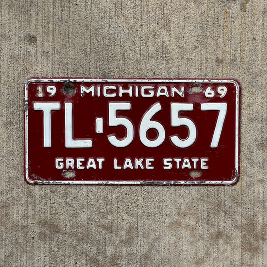 Photo of a 1969 Michigan License Plate Auto Tag Garage Decor Vintage TL 5657 with original patina