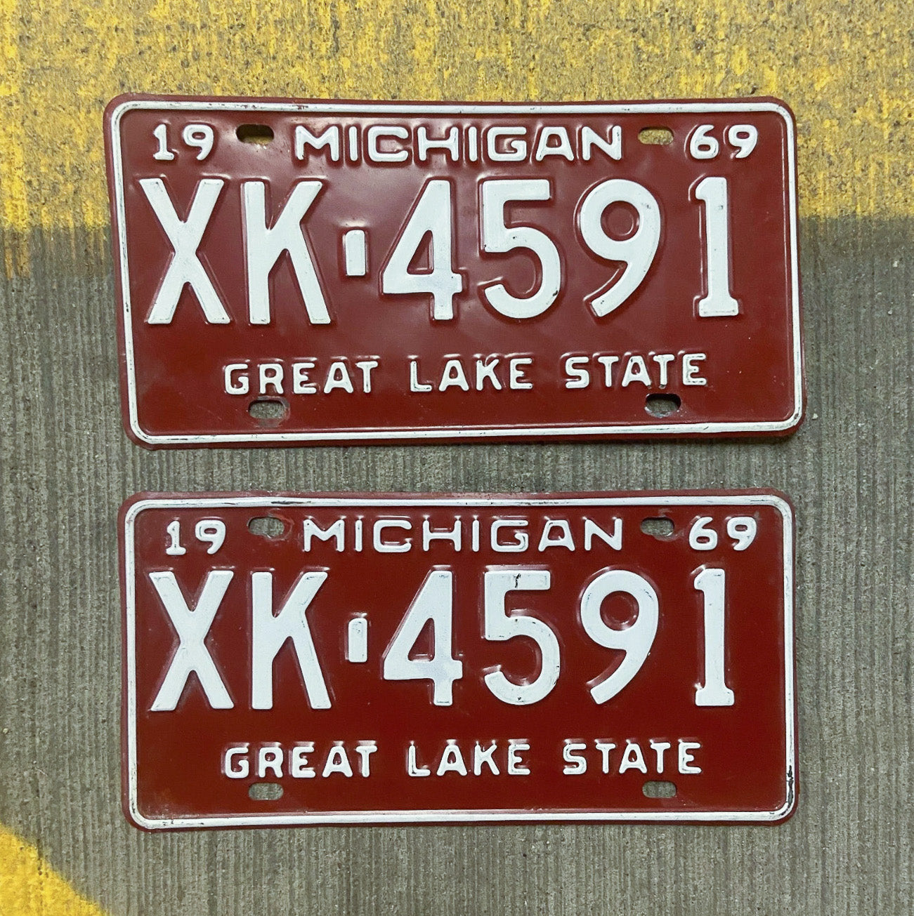 Photo of a 1969 Michigan License Plate Pair Auto Tag Garage Decor Vintage XK 4591 with original patina