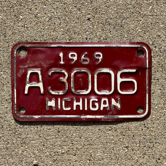 Photo of a 1969 Michigan Motorcycle License Plate Auto Tag Garage Decor Vintage A Series A 3006