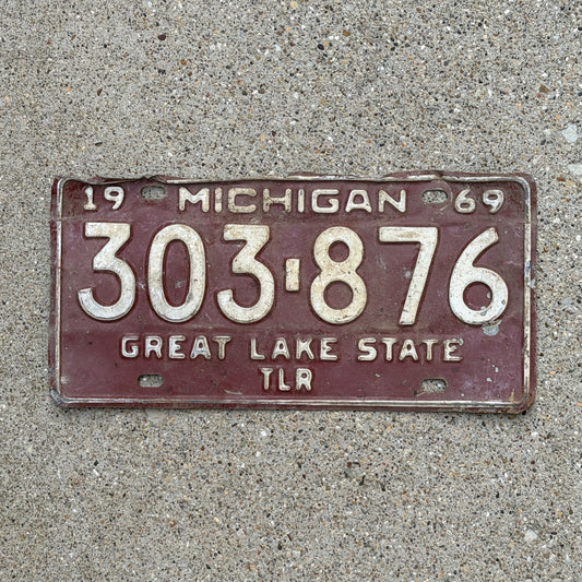 Photo of a 1969 Michigan Trailer License Plate Auto Tag Garage Decor Vintage 303 876 with original patina