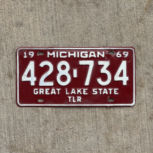 Photo of a 1969 Michigan Trailer License Plate Auto Tag Garage Decor Vintage 428 734 with original patina