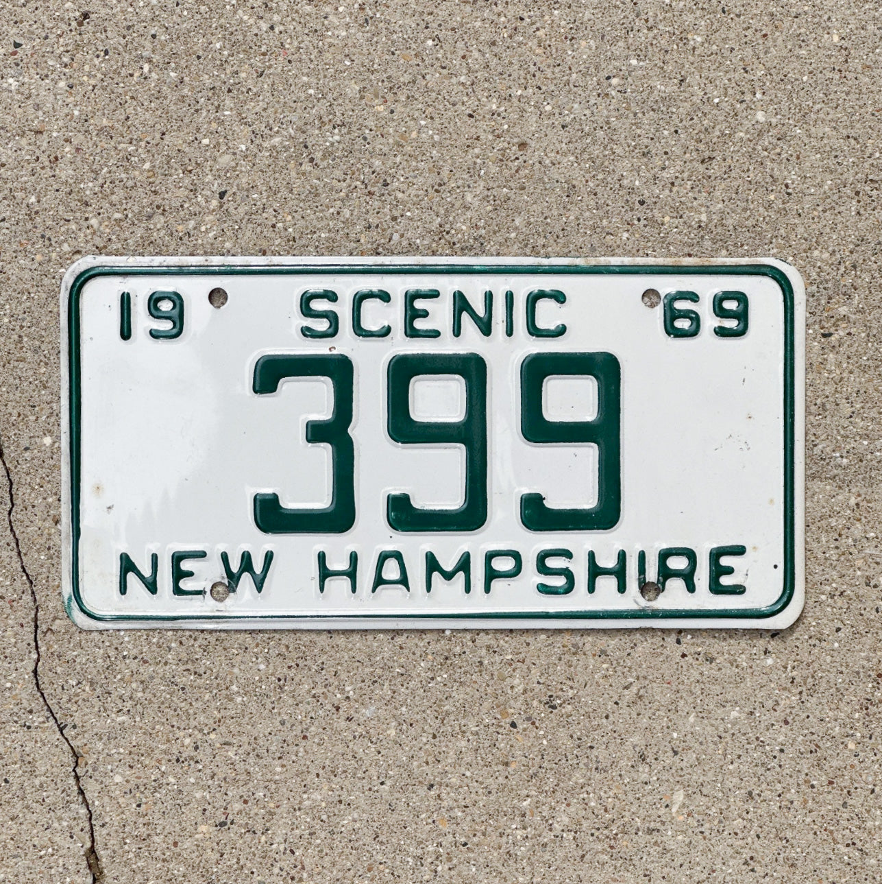 Photo of a 1969 New Hampshire License Plate Auto Tag 1 Vintage Garage Low Number Three Digit 399 with original patina