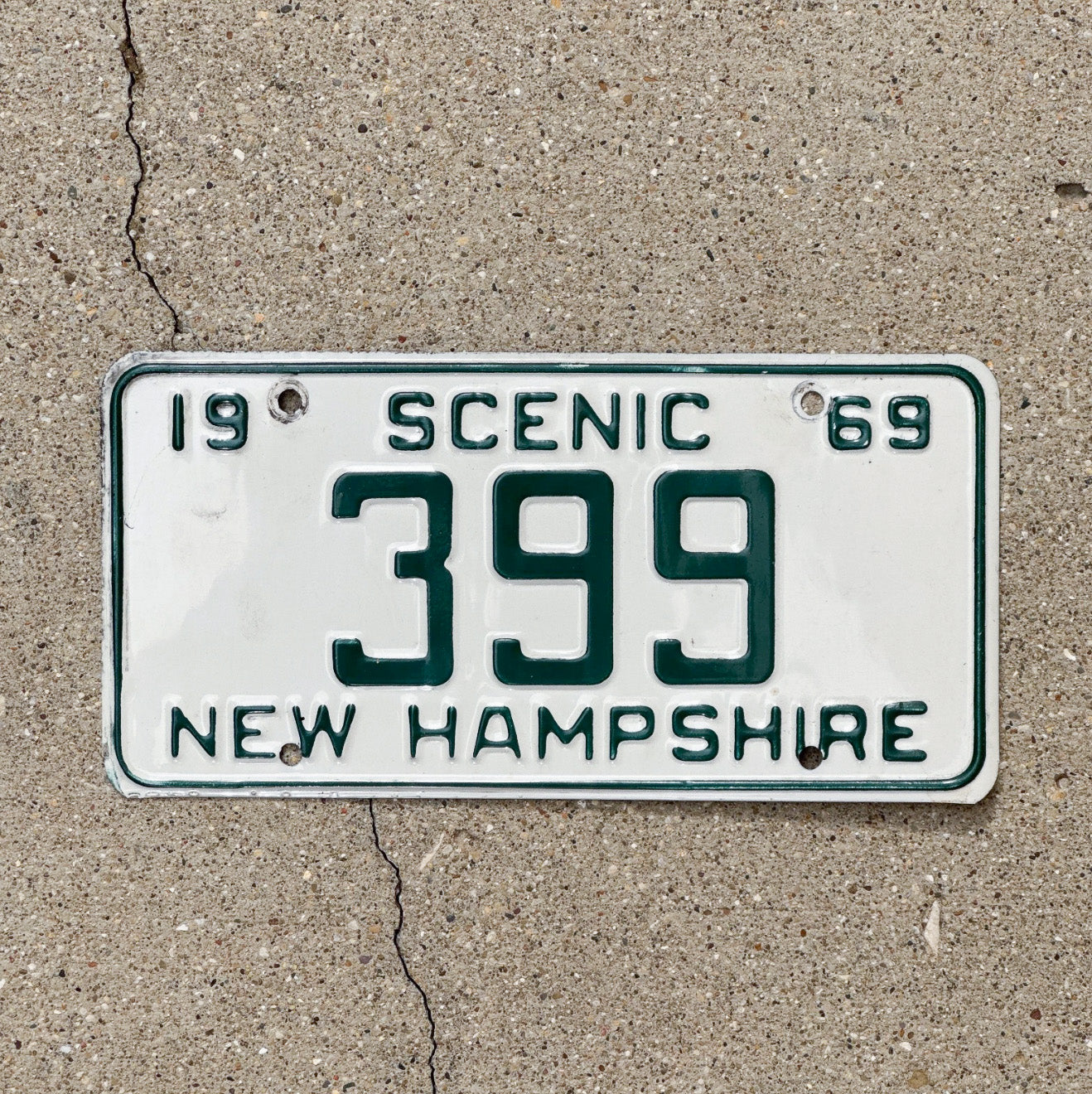 Photo of a 1969 New Hampshire License Plate Auto Tag 2 Vintage Garage Low Number Three Digit 399 with original patina