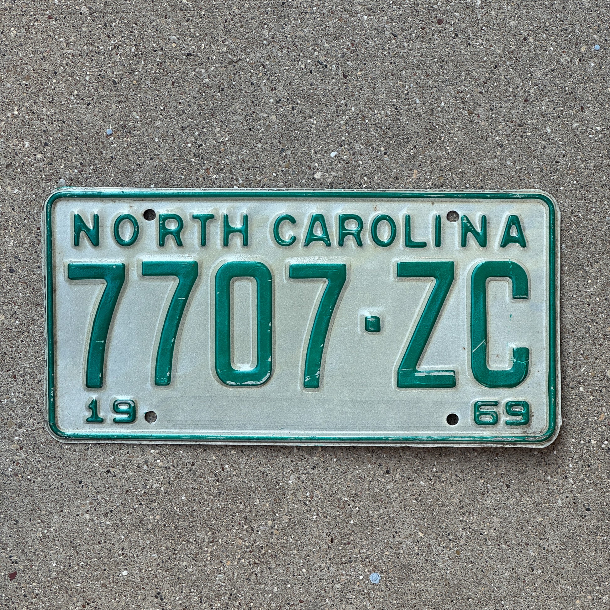 Photo of a 1969 North Carolina Trailer License Plate Auto Tag Garage Decor Vintage 7707 ZC with original patina