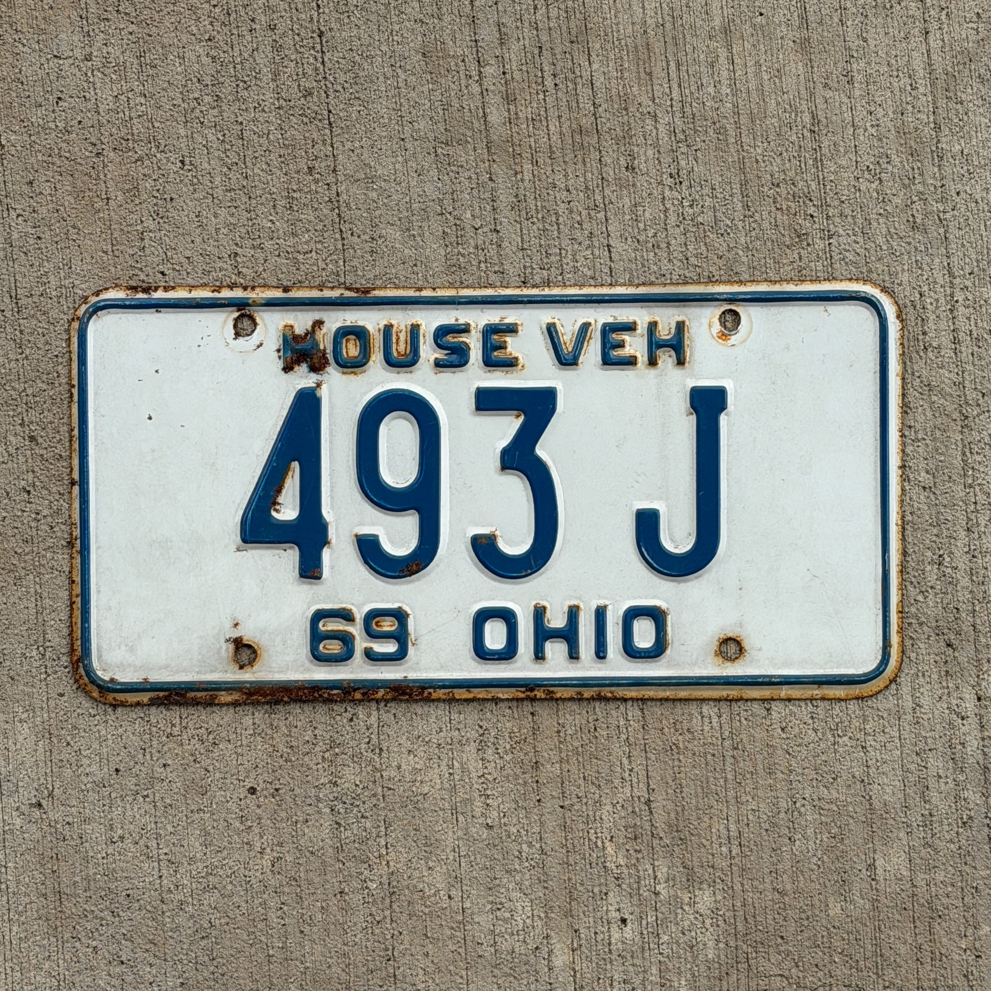 Photo of a 1969 Ohio House Vehicle License Plate Auto Tag Garage Decor Vintage 493 J with original patina
