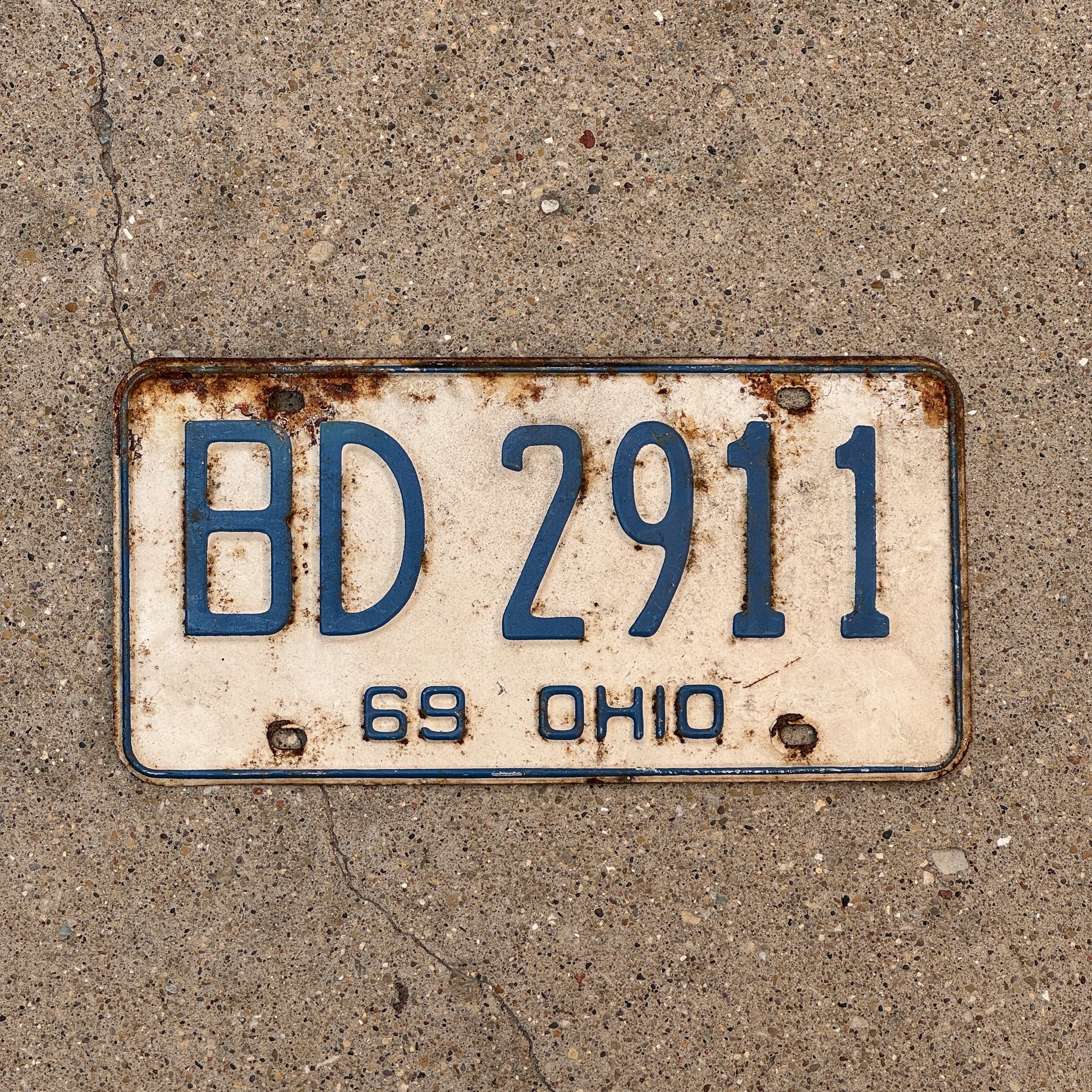 Photo of a 1969 Ohio License Plate Auto Tag 1 Vintage Garage BD 2911 with original patina