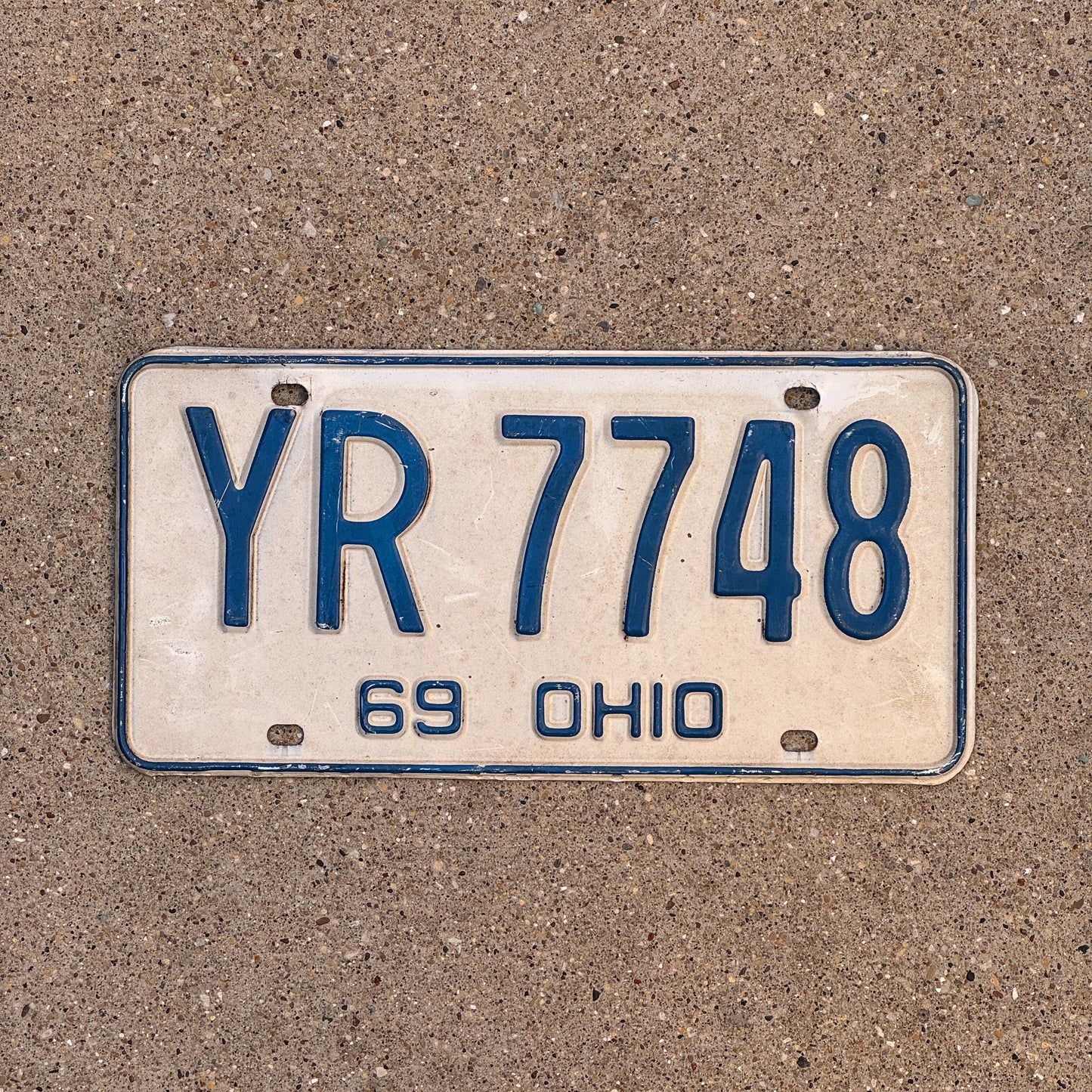 Photo of a 1969 Ohio License Plate Auto Tag 2 Vintage Garage YR 7748 with original patina