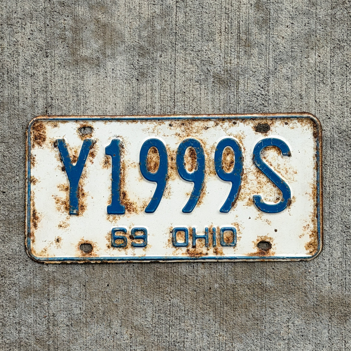 Photo of a 1969 Ohio License Plate Auto Tag Garage Decor Vintage Repeat Repeating Y 1999 S with original patina