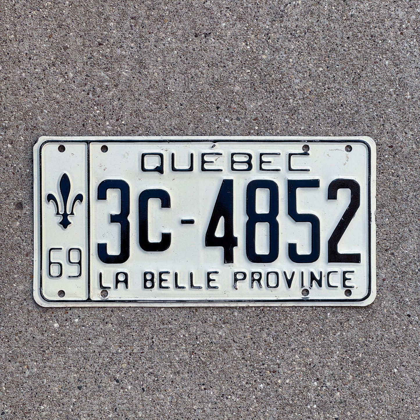 Photo of a 1969 Quebec License Plate Auto Tag Garage Decor Vintage 3C 4852 with original patina