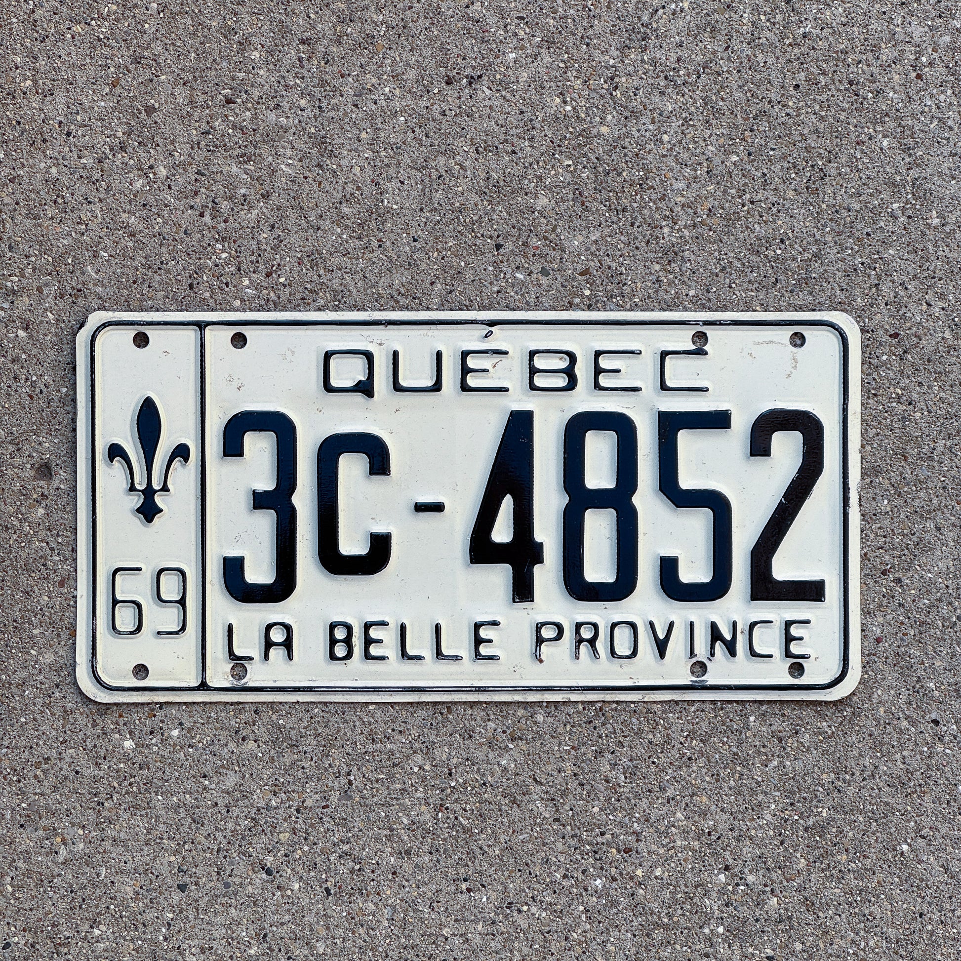 Photo of a 1969 Quebec License Plate Auto Tag Garage Decor Vintage 3C 4852 with original patina