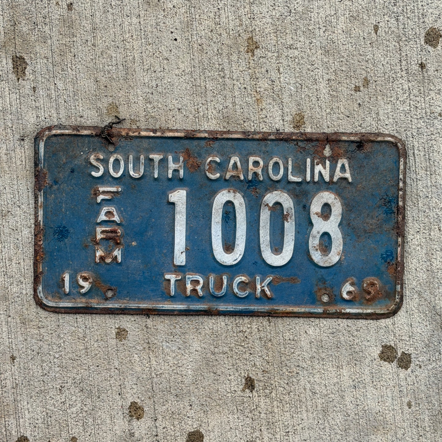 Photo of a 1969 South Carolina Farm Truck License Plate Auto Tag Garage Decor Vintage 1008 with original patina