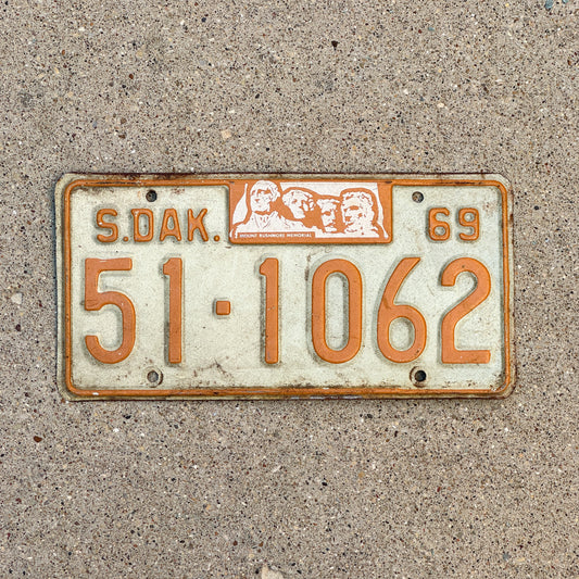 Photo of a 1969 South Dakota License Plate Auto Tag Garage Decor Vintage Mount Rushmore 51 1062 with original patina