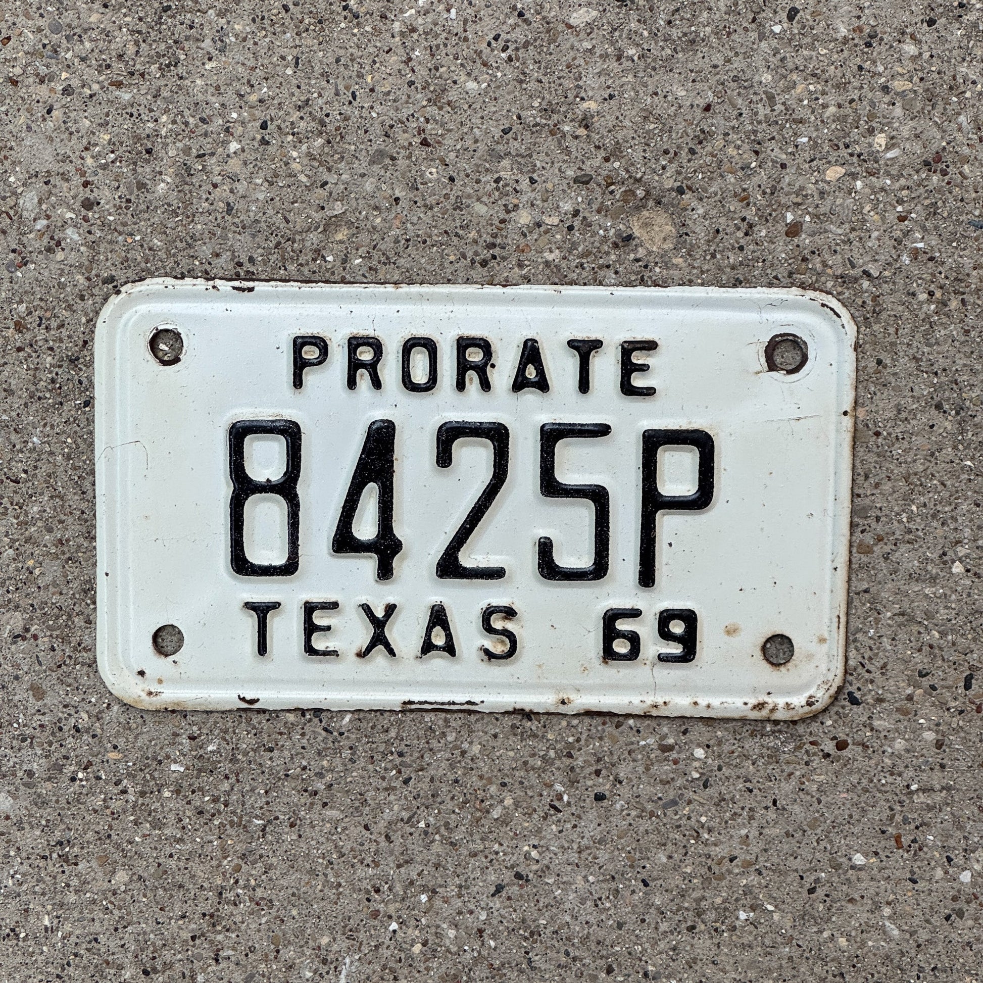 Photo of a 1969 Texas Prorate License Plate Auto Tag Garage Decor Vintage 8425 P with original patina