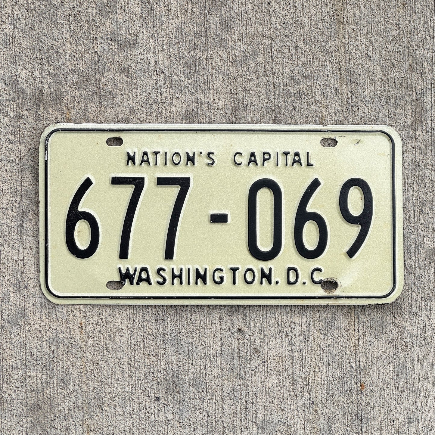 Photo of a 1969 Washington DC License Plate Auto Tag Garage Decor Vintage 677 069 with original patina