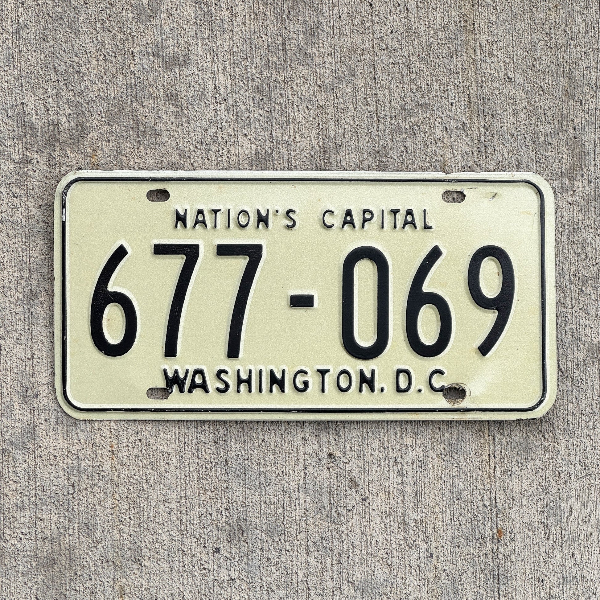 Photo of a 1969 Washington DC License Plate Auto Tag Garage Decor Vintage 677 069 with original patina