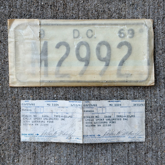 Photo of a 1969 Washington DC Motorcycle License Plate Auto Tag Garage Decor Vintage With Envelope & Registration M 2992 with original patina