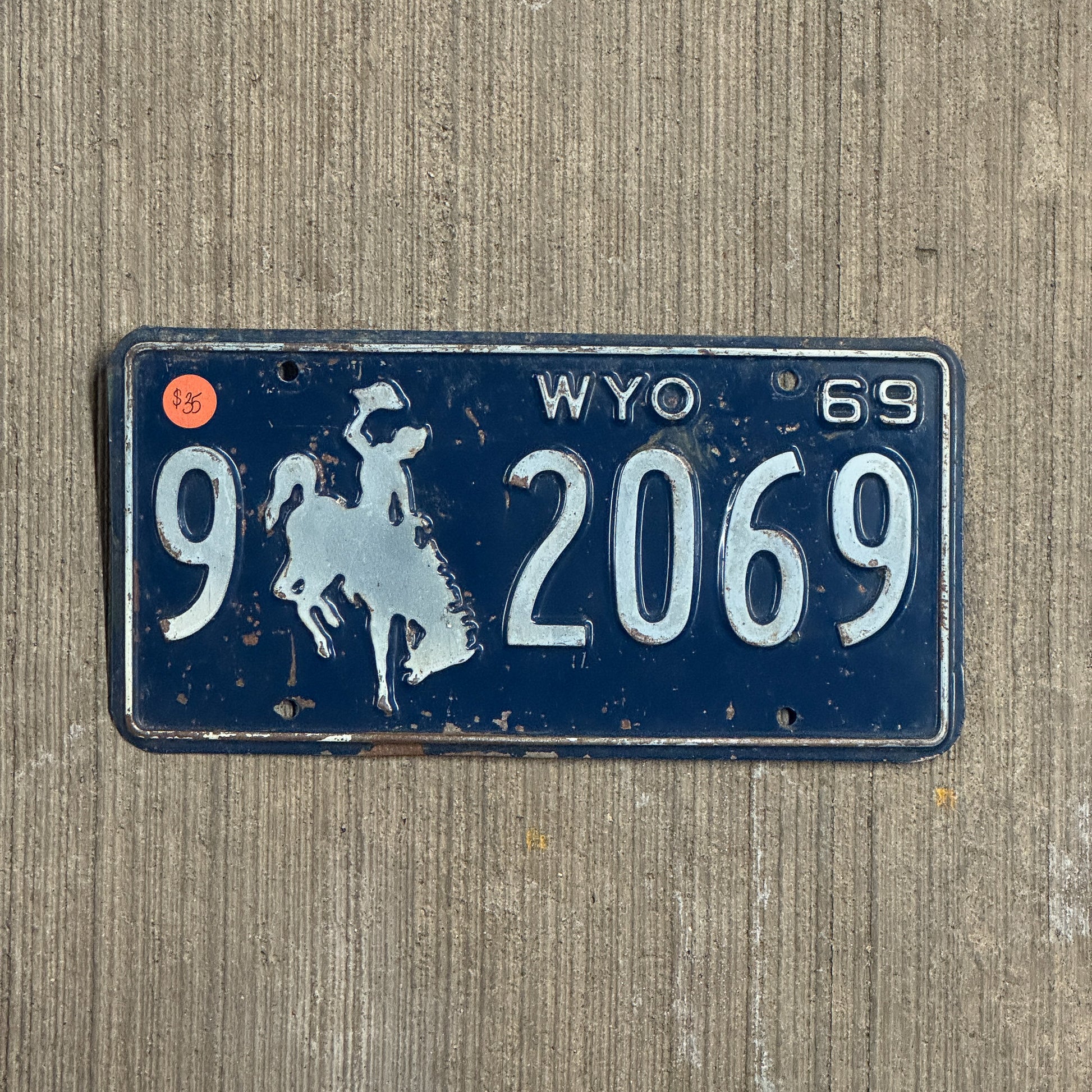 Photo of a 1969 Wyoming License Plate Auto Tag Garage Decor Vintage 9 2069 with original patina
