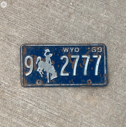 Photo of a 1969 Wyoming License Plate Auto Tag Garage Decor Vintage Lucky 7 Repeat Repeating 9 2777 with original patina