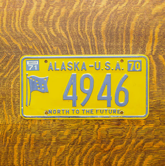 Photo of a 1970 1971 Alaska License Plate Auto Tag Garage Decor Vintage Four Digit Low Number 4946 with original patina