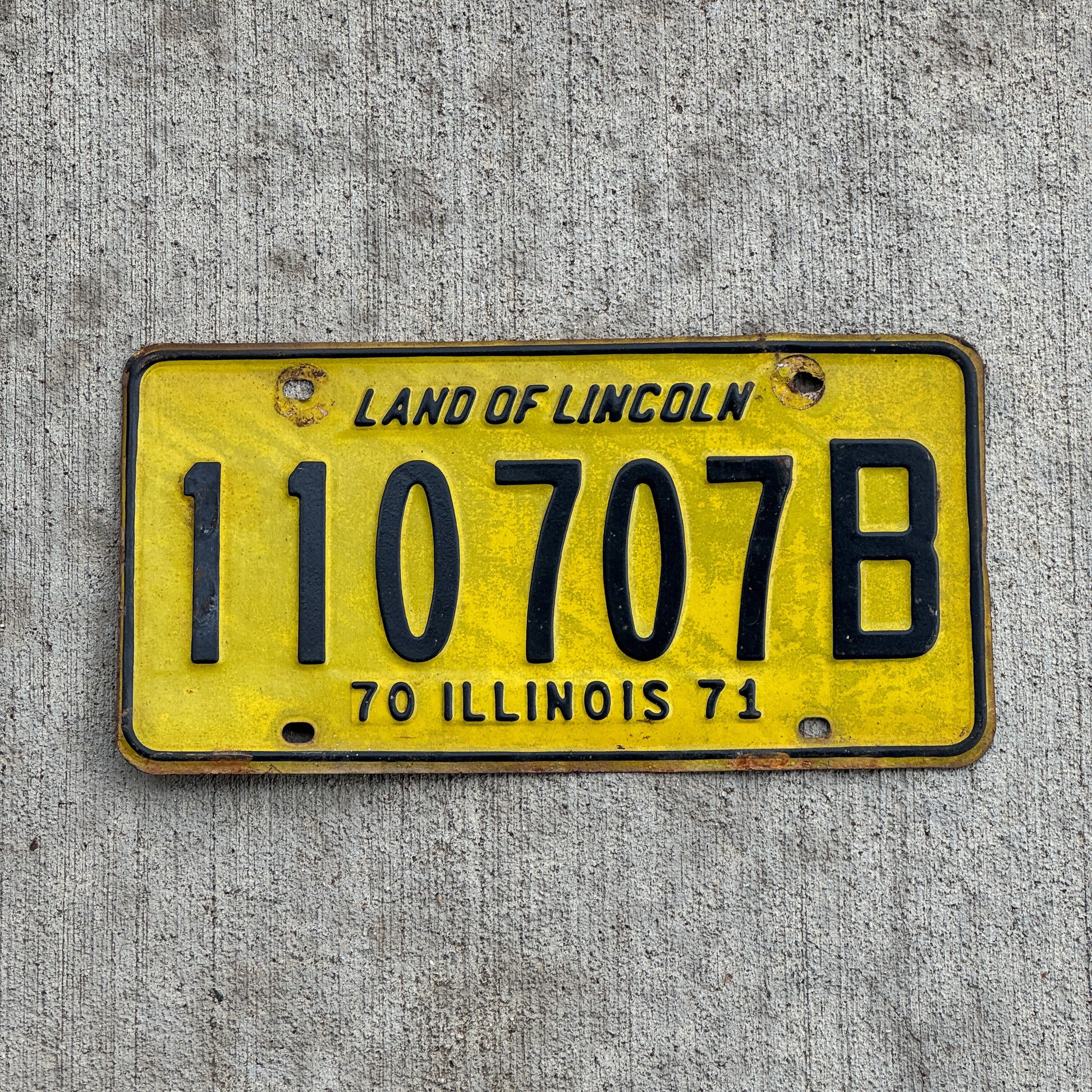 Photo of a 1970 1971 Illinois Truck License Plate Auto Tag Garage Decor Vintage 110 707 B with original patina