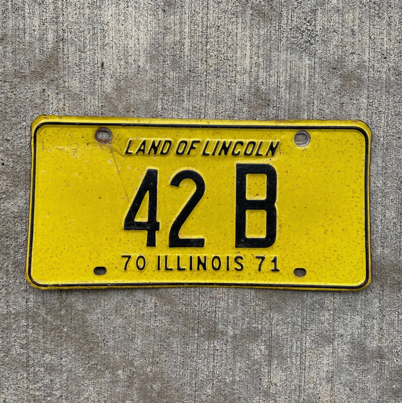 Photo of a 1970 1971 Illinois Truck License Plate Auto Tag Garage Decor Vintage Low Number Two Digit 42 B with original patina