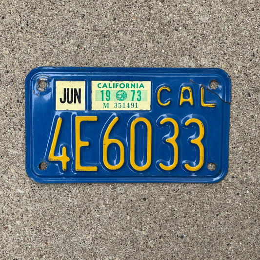 Photo of a 1970 1973 California Motorcycle License Plate Auto Tag Garage Decor Vintage 4E6033 with original patina