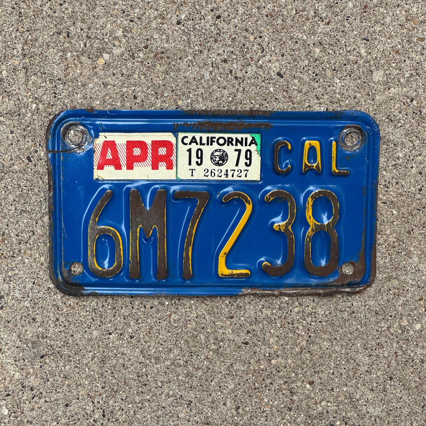 Photo of a 1970 1979 California Motorcycle License Plate Auto Tag Garage Decor Vintage 6M7238 with original patina