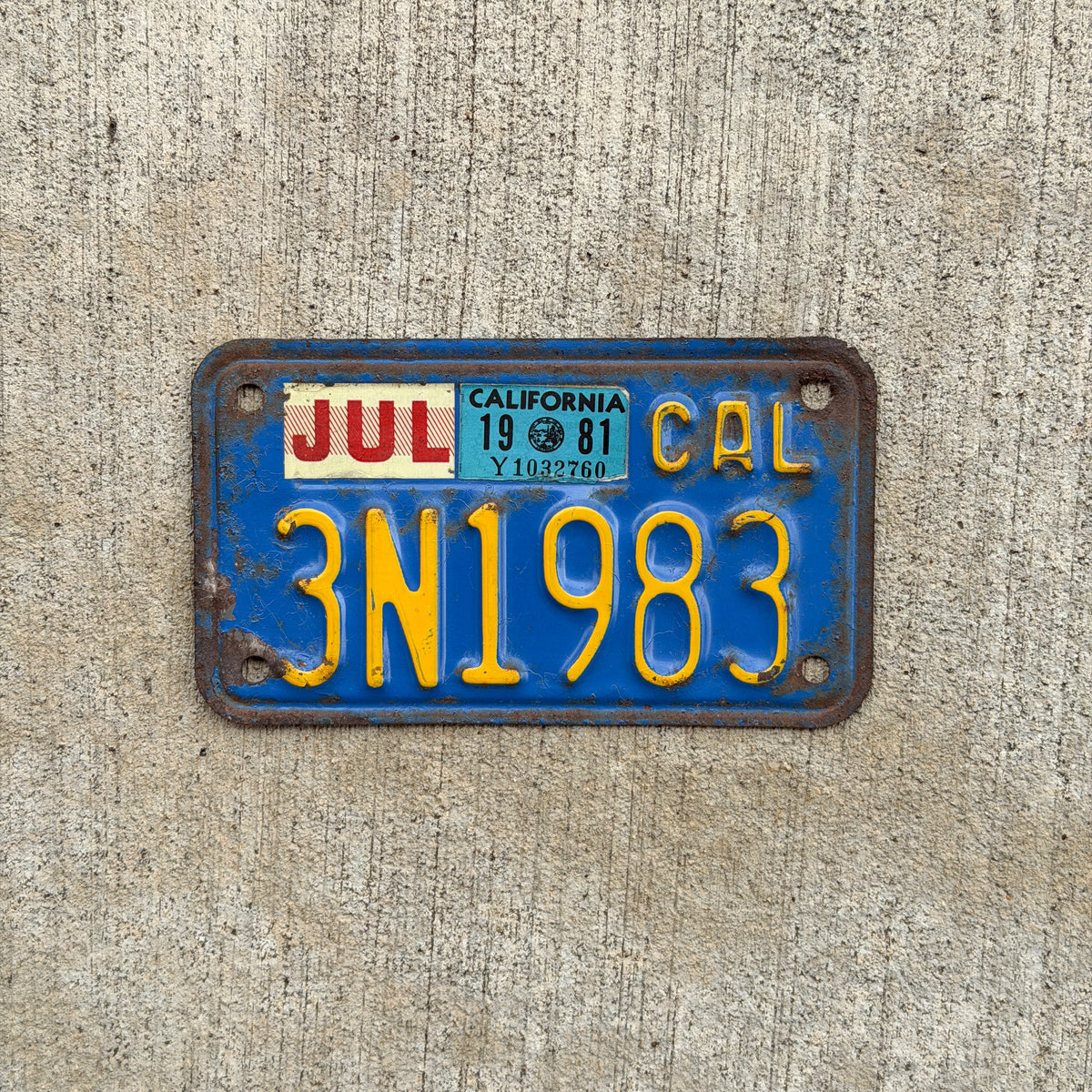 Photo of a 1970 1981 California Motorcycle License Plate Auto Tag Garage Decor Vintage DMV Clear Number 3 N 1983 with original patina