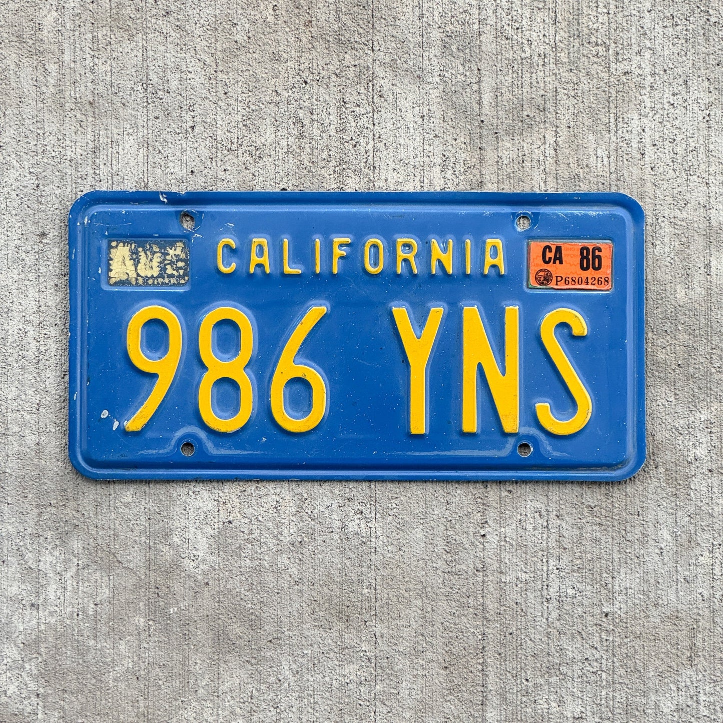 Photo of a 1970 1986 California License Plate Auto Tag Garage Decor Vintage 986 YNS with original patina