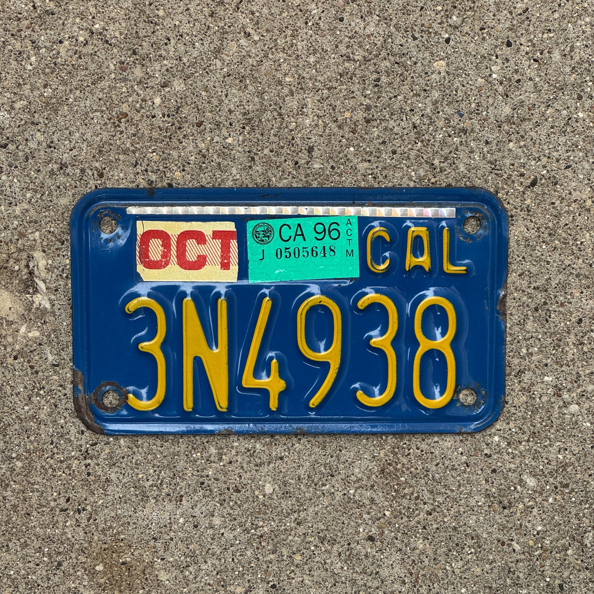 Photo of a 1970 1996 California Motorcycle License Plate Auto Tag Garage Decor Vintage 3N4938 with original patina