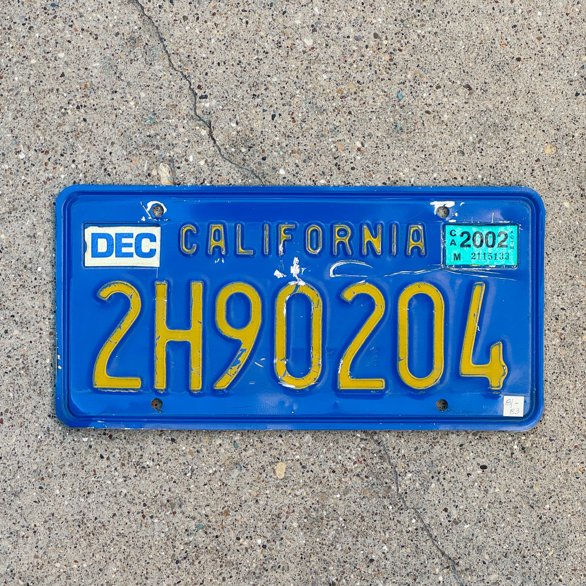 Photo of a 1970 2002 California Commercial License Plate Auto Tag Garage Decor Vintage 2H90204 with original patina
