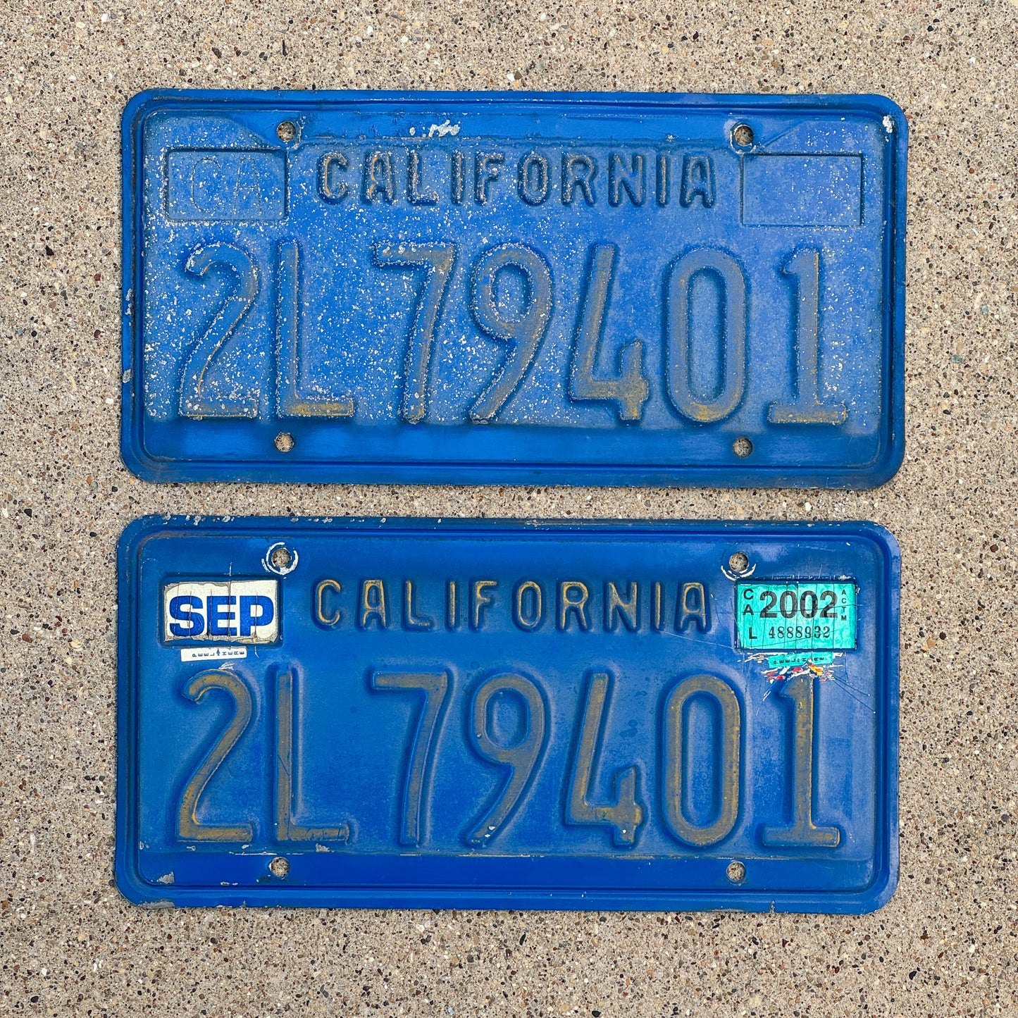 Photo of a 1970 2002 California Commercial License Plate Pair Auto Tag Garage Decor Vintage DMV Clear Number 2L79401 with original patina