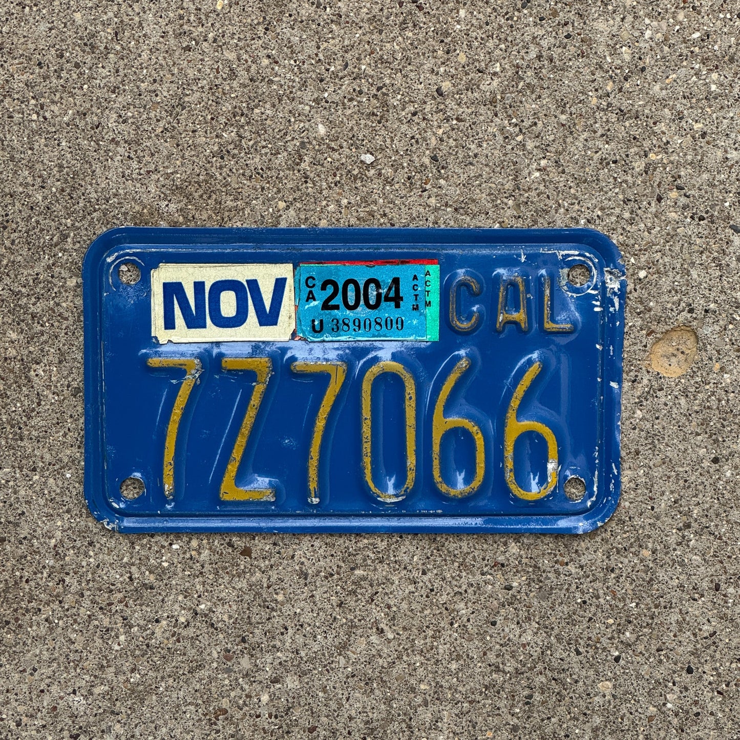 Photo of a 1970 2004 California Motorcycle License Plate Auto Tag Garage Decor Vintage 7Z7066 with original patina
