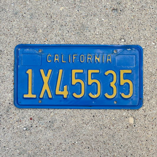 Photo of a 1970 California Commercial License Plate Auto Tag Garage Decor Vintage 1X45535 with original patina