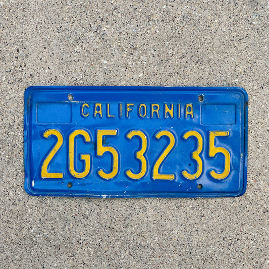 Photo of a 1970 California Commercial License Plate Auto Tag Garage Decor Vintage 2G53235 with original patina