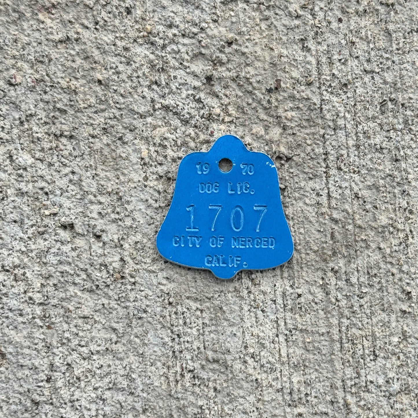 Photo of a 1970 California Dog License Auto Tag Garage Decor Vintage Merced 1707 with original patina