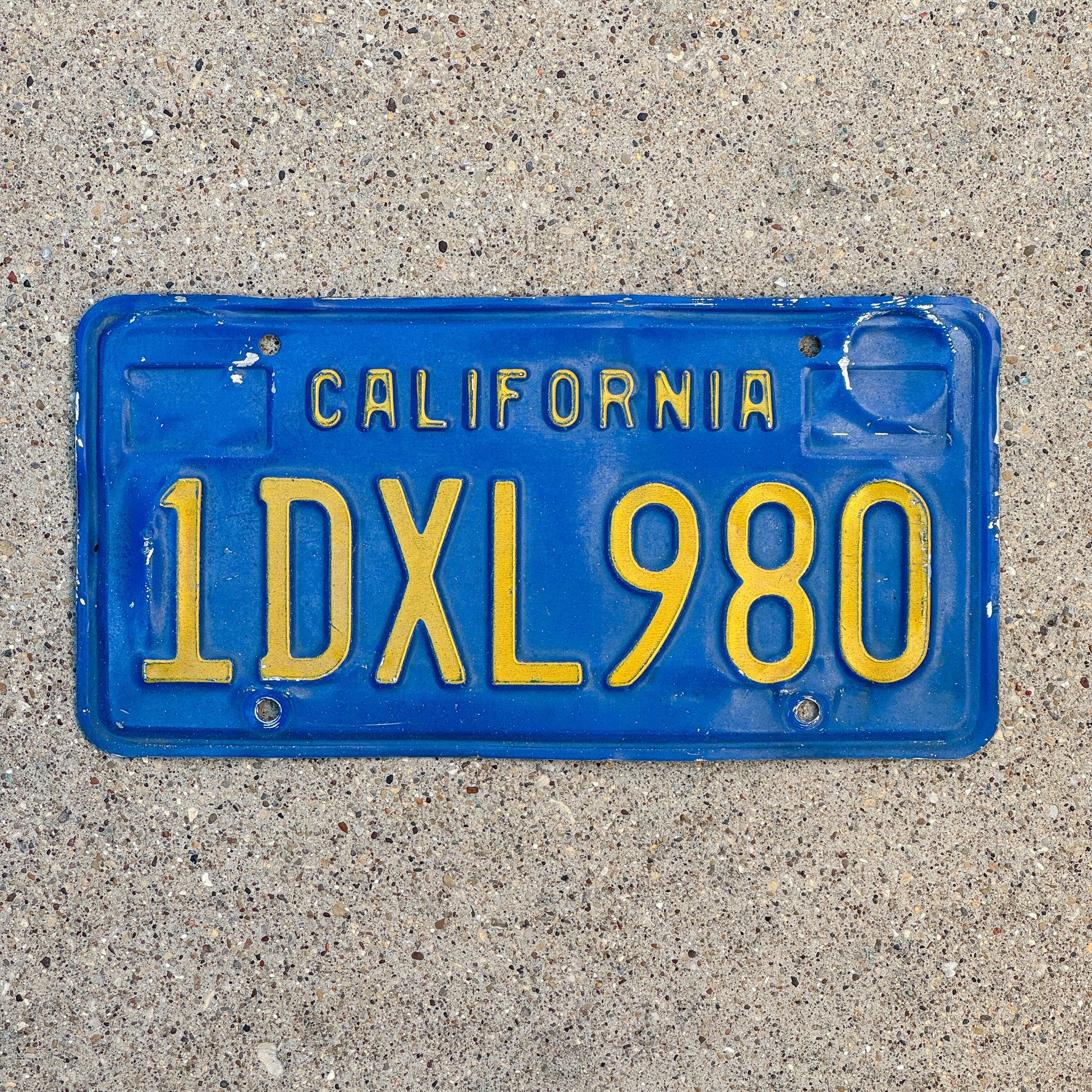 Photo of a 1970 California License Plate Auto Tag Garage Decor Vintage 1 DXL 980 with original patina