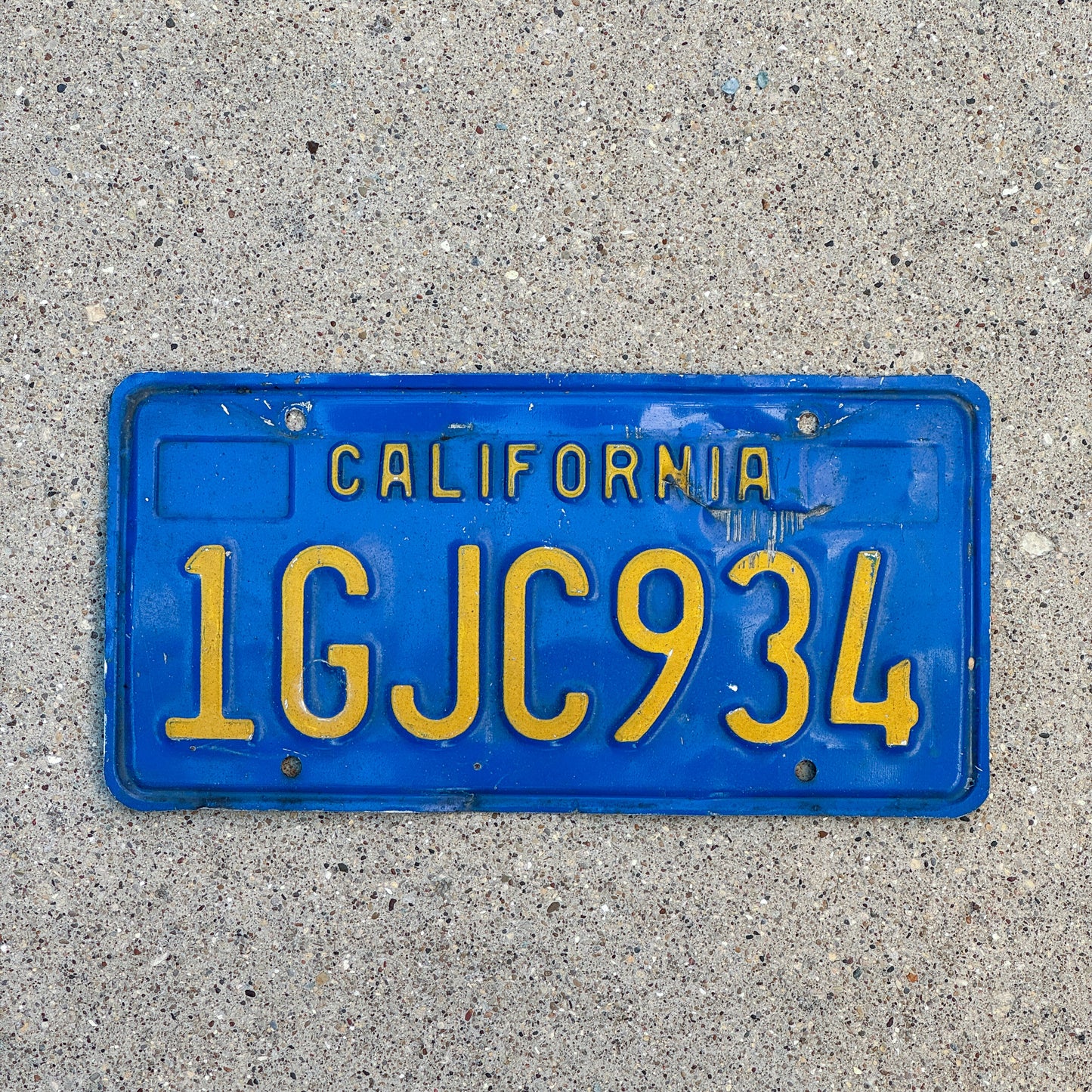 Photo of a 1970 California License Plate Auto Tag Garage Decor Vintage 1 GJC 934 with original patina