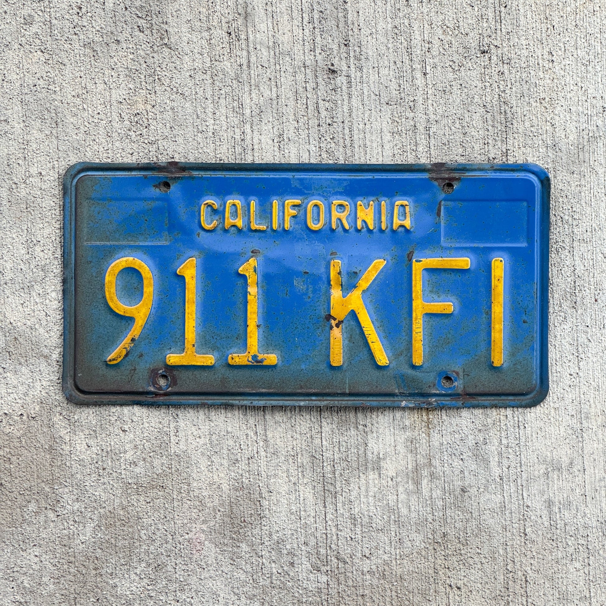 Photo of a 1970 California License Plate Auto Tag Garage Decor Vintage 911 KFI with original patina