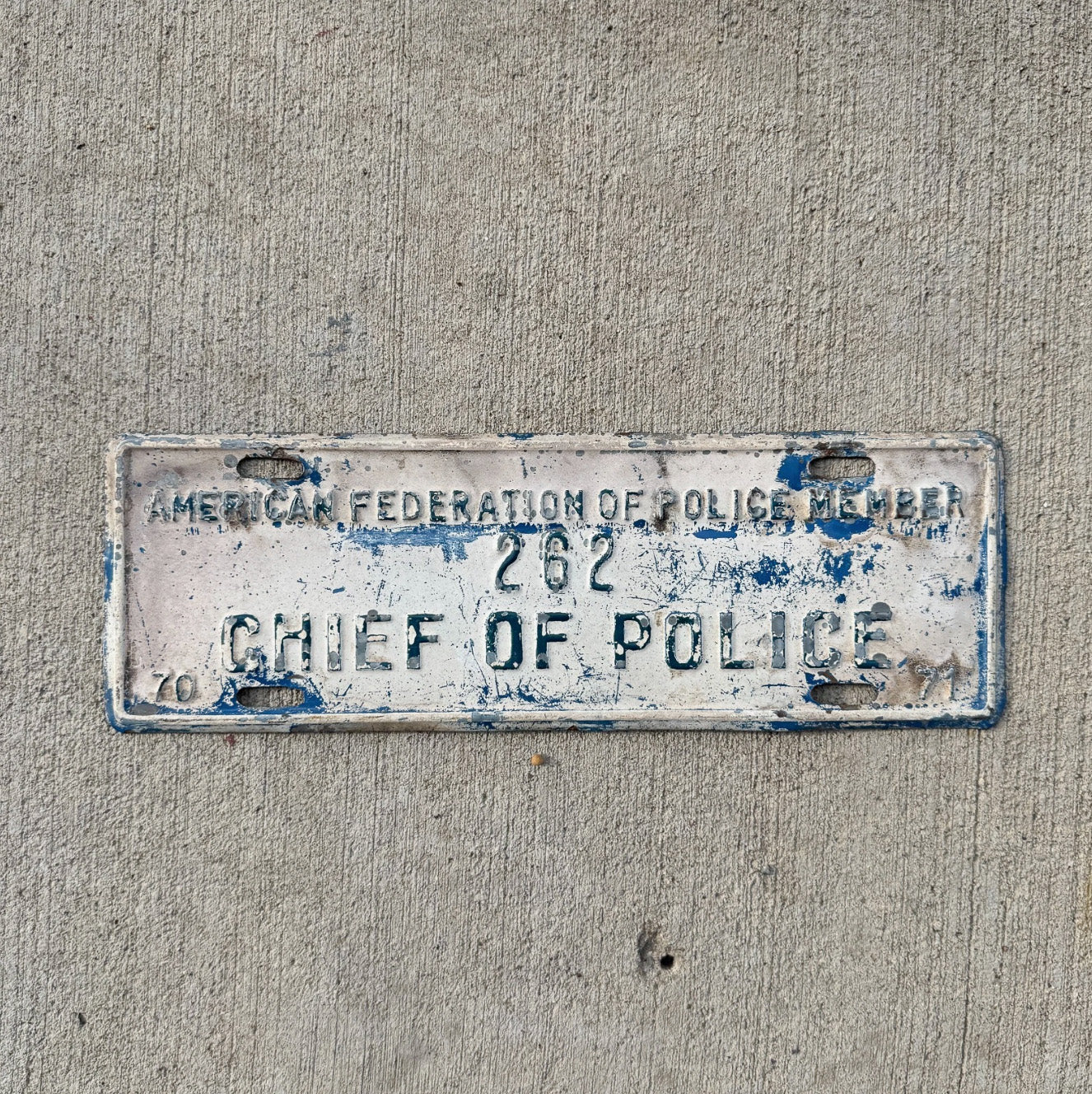 Photo of a 1970 Chief of Police License Plate Topper Auto Tag Garage Decor Vintage American Federation of Police Cop 262 with original patina
