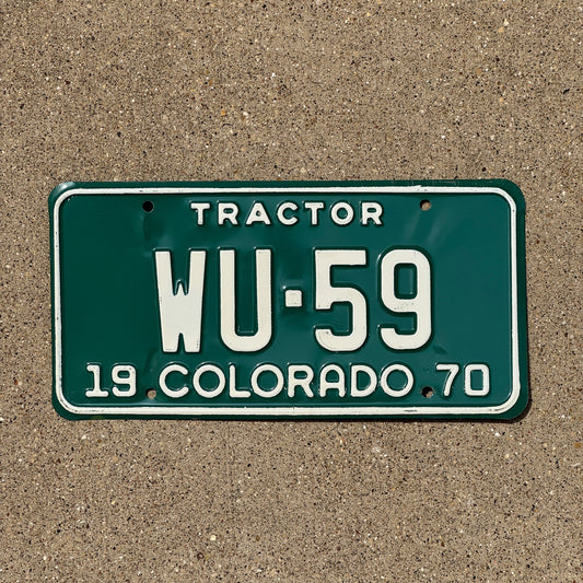 Photo of a 1970 Colorado Tractor License Plate Auto Tag Garage Decor Vintage WU 59