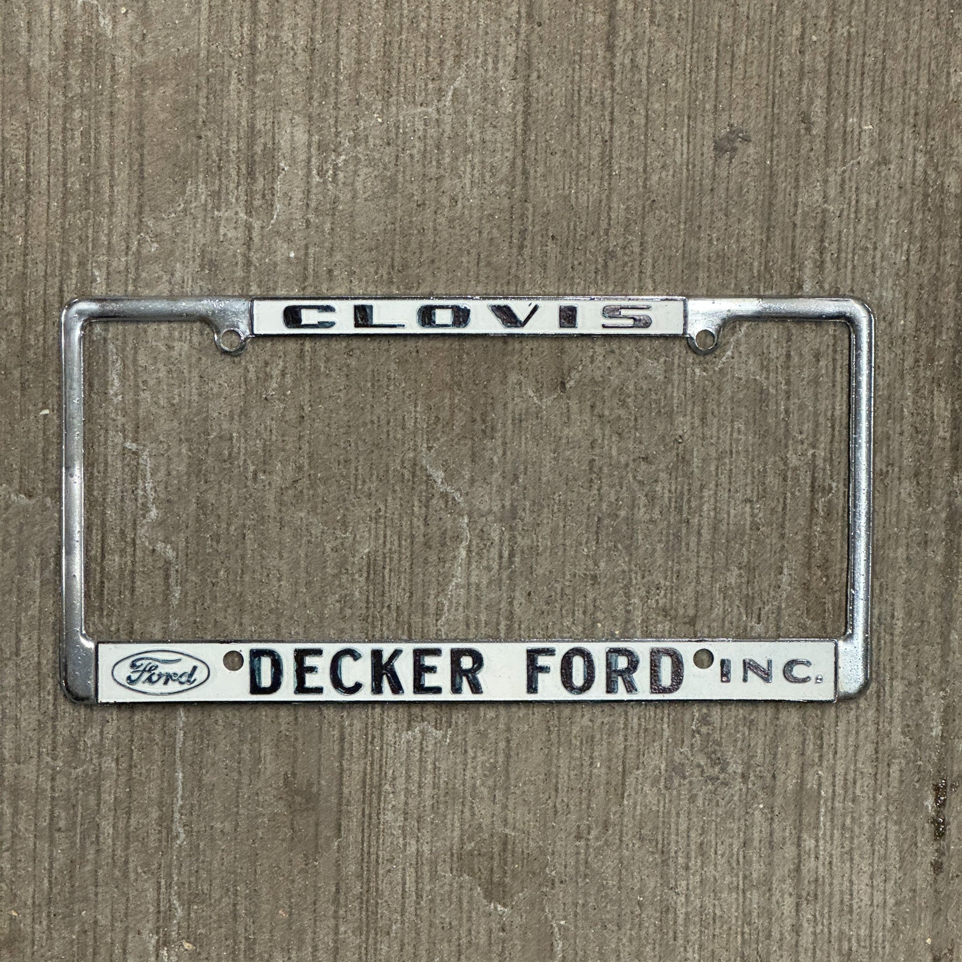 Photo of a 1970 Era California License Plate Frame Auto Tag Garage Decor Vintage Clovis Metal Metal Decker Ford with original patina
