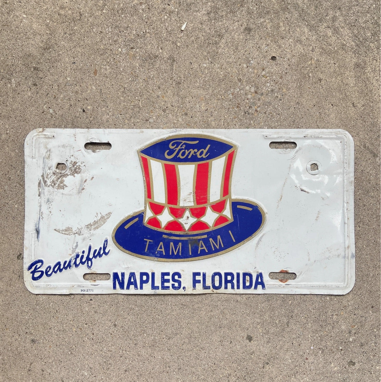 Photo of a 1970 Era Florida Booster License Plate Auto Tag Garage Decor Vintage Tamiami Ford Naples with original patina