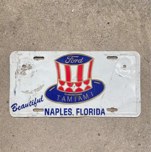 Photo of a 1970 Era Florida Booster License Plate Auto Tag Garage Decor Vintage Tamiami Ford Naples with original patina