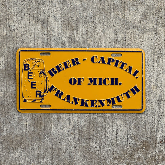 Photo of a 1970 Era Frankenmuth Michigan Booster License Plate Auto Tag Garage Decor Vintage Beer Capital Vintage Bar Decor Metal with original patina