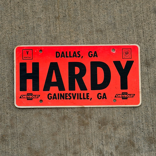 Photo of a 1970 Era Hardy Gainesville Georgia Booster License Plate Auto Tag Garage Decor Vintage
 Pontiac Buick Chevrolet Cardstock with original patina