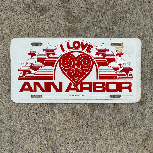 Photo of a 1970 Era I Love Ann Arbor Michigan Booster License Plate Auto Tag Garage Decor Vintage Metal with original patina