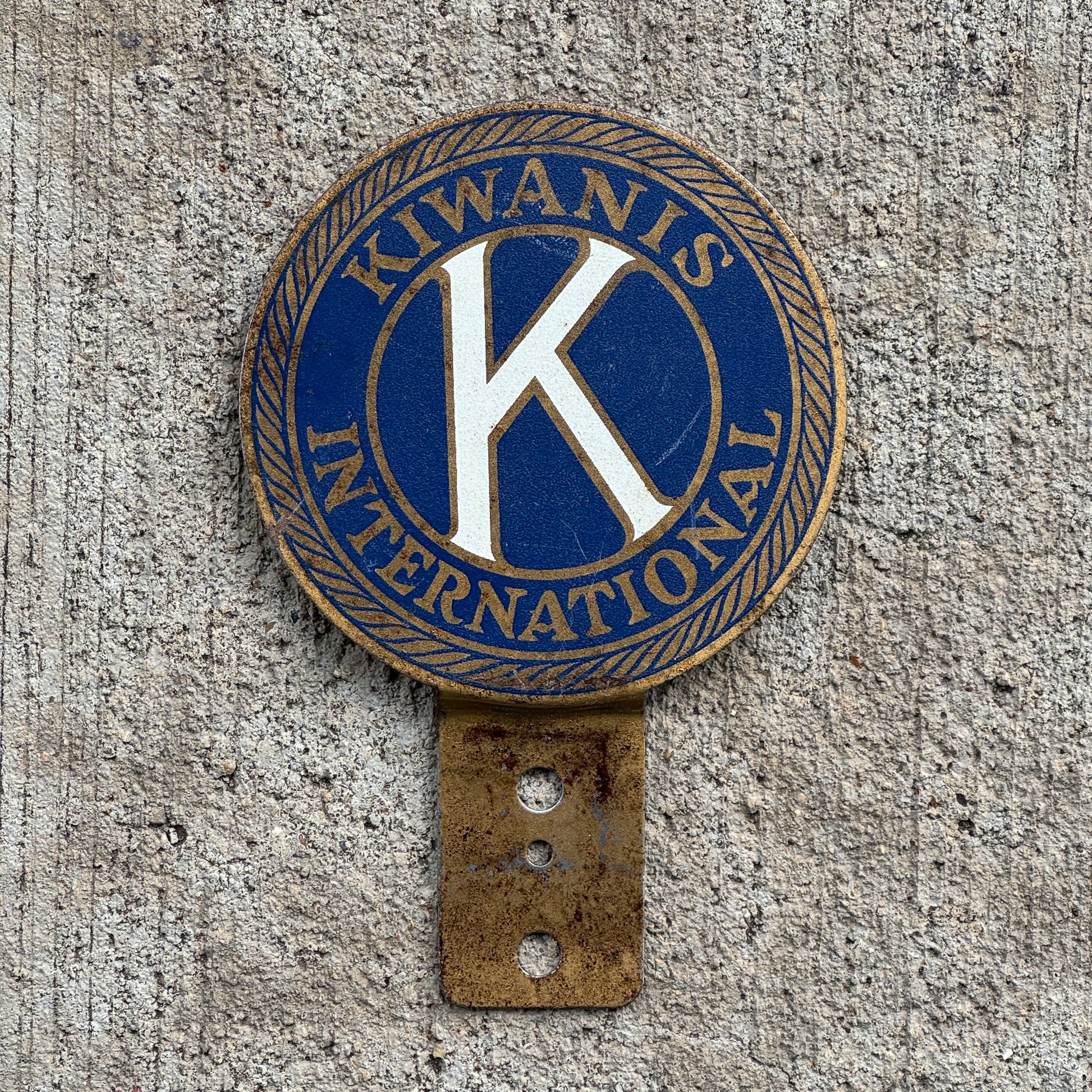Photo of a 1970 Era Kiwanis International License Plate Topper Auto Tag Garage Decor Vintage with original patina