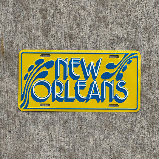 Photo of a 1970 Era New Orleans Louisiana Booster License Plate Auto Tag Garage Decor Vintage Metal with original patina