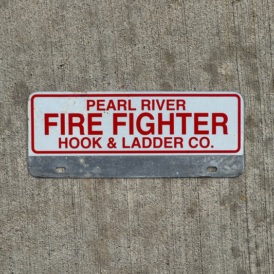 Photo of a 1970 Era Pearl River Hook Ladder Co New York Fire Fighter License Plate Topper Auto Tag Garage Decor Vintage with original patina